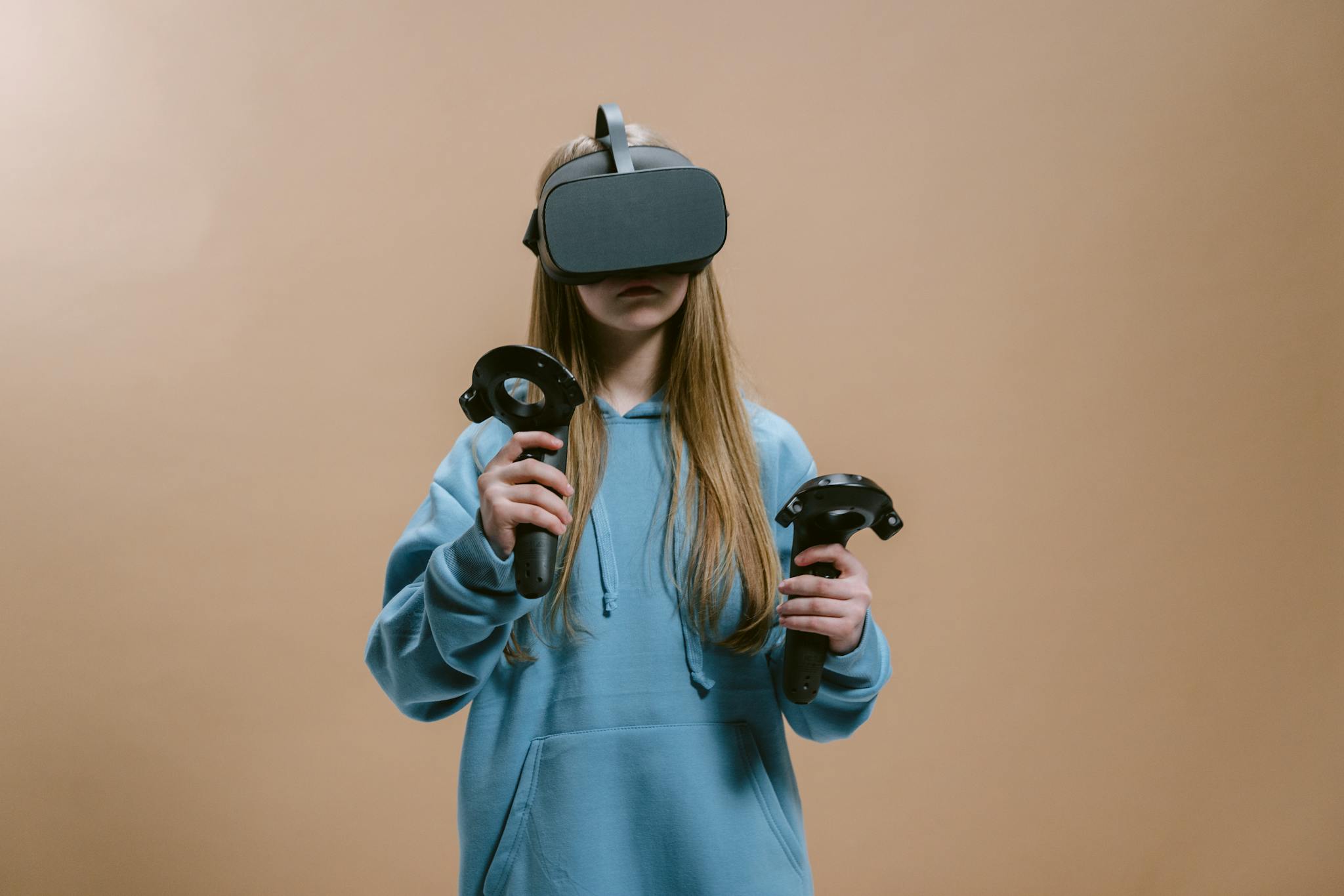 Woman using a virtual reality headset with controllers